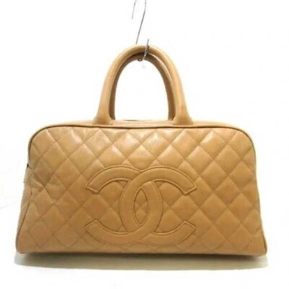 CHANEL Handbags - Vintage Chanel Beige Caviar Bowling Bag